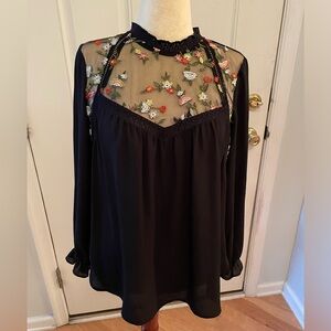 Pleione long sleeve black blouse with embroidered lace inset. Size Medium.
